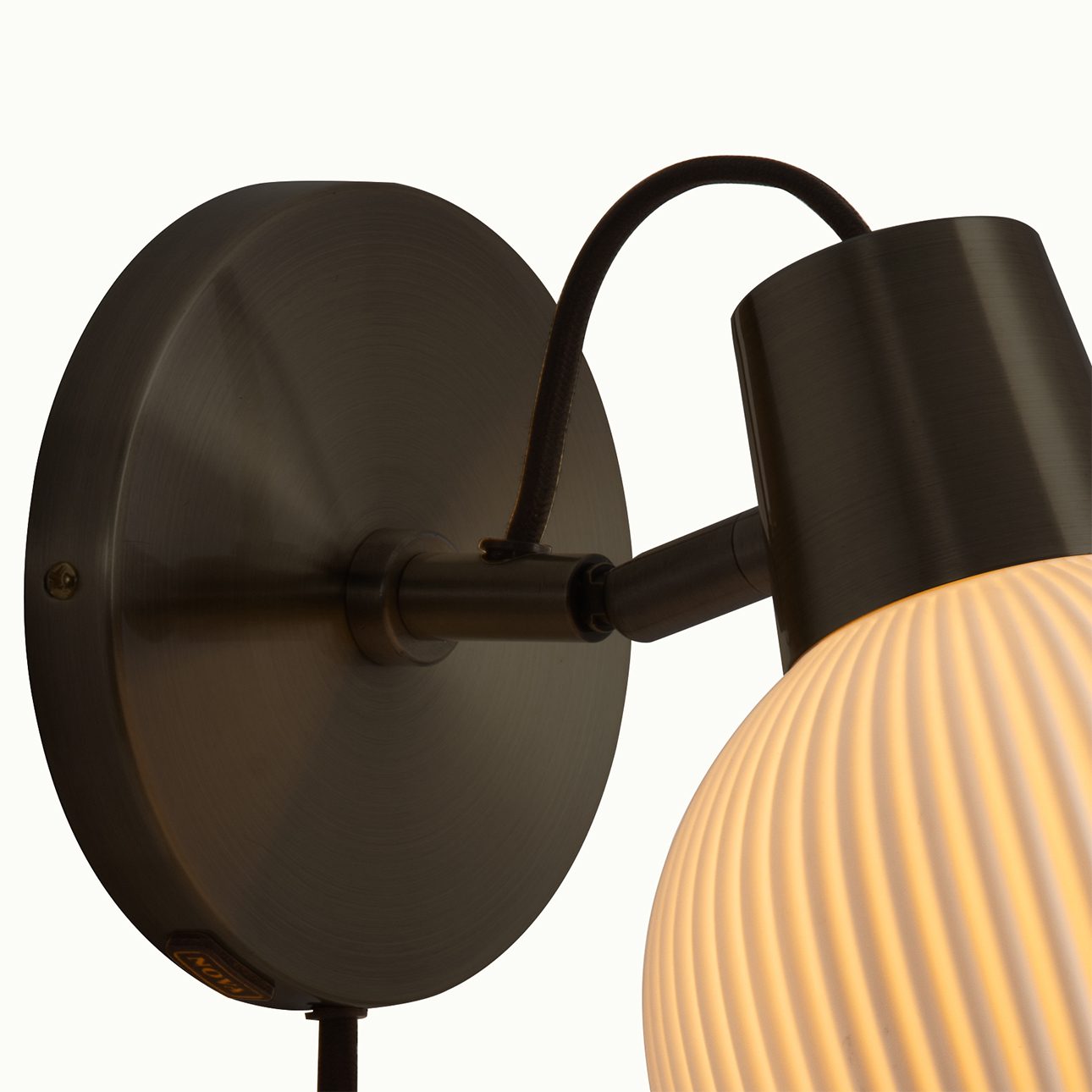 Petaluma Porcelain Wall Sconce in Black with Warm Glow