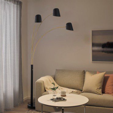 An arc floor lamp is a freestanding lamp with a curved arm that extends outward from a stable base.